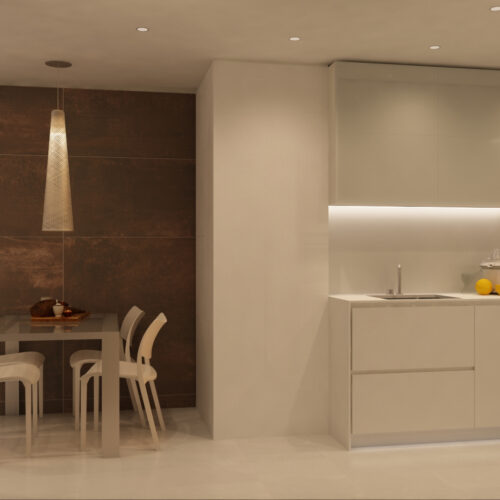 Moderna cocina de diseño interior en Barcelona con mesa de comedor blanca, sillas elegantes y lámpara colgante en un espacio luminoso. Armarios de líneas limpias en tonos claros y muros de fondo en marrón aportan un ambiente sofisticado con alta calidad en materiales.