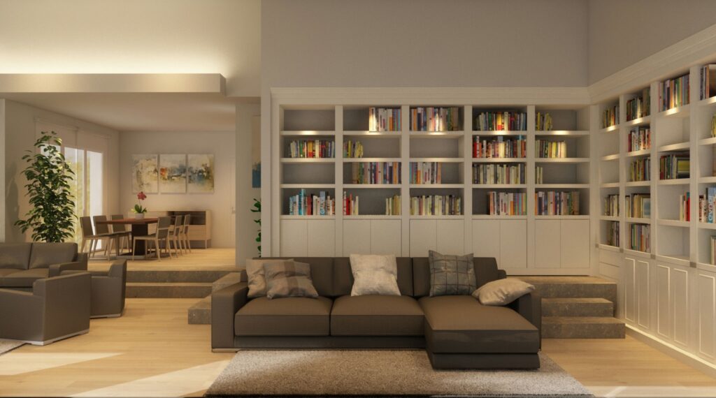 Diseño de interiores moderno en Barcelona: Sala de estar elegante y funcional Sala de estar moderna en Barcelona con sofá seccional marrón, estantería y mesa de comedor de madera, iluminada por luz natural.