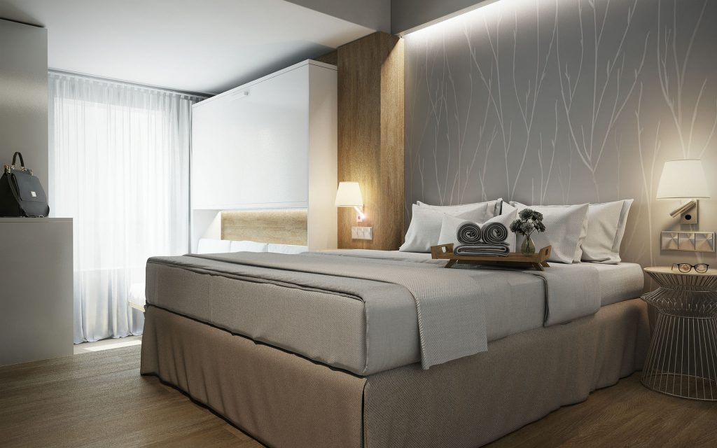 Hotel Montarto: Moderno dormitorio en Barcelona con cama king size, ropa de cama de alta calidad, decoración contemporánea y uso eficiente de luz natural, ideal para inspirar el diseño de interiores.