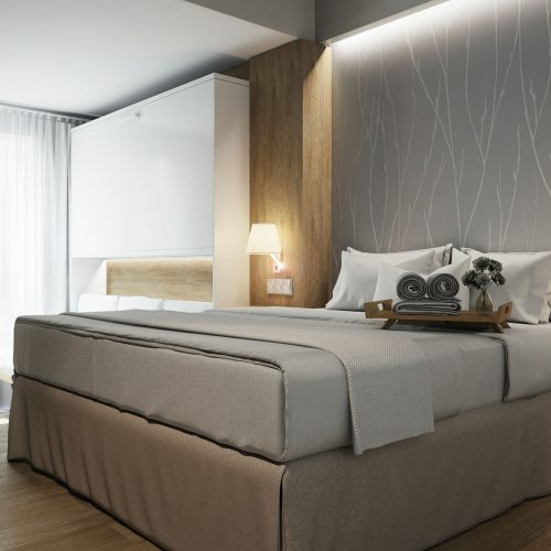 Hotel Montarto: Moderno dormitorio en Barcelona con cama king size, ropa de cama de alta calidad, decoración contemporánea y uso eficiente de luz natural, ideal para inspirar el diseño de interiores.