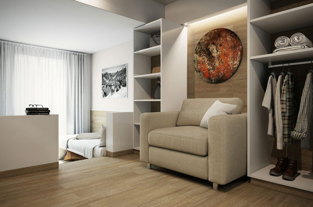 Diseño de interiores moderno en Barcelona: sala luminosa con estética contemporánea Sala de estar con un sillón beige y arte abstracto en la pared, destacando la arquitectura de alta gama en Barcelona