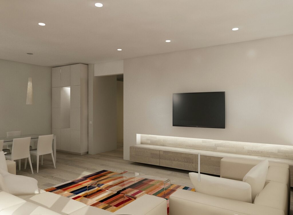 Proyecto de Diseño de Interiores Moderno en Barcelona Sala de estar moderna y luminosa en Barcelona, con sofá blanco y alfombra de rayas. Diseño contemporáneo con muebles personalizados y detalles arquitectónicos de alta gama.