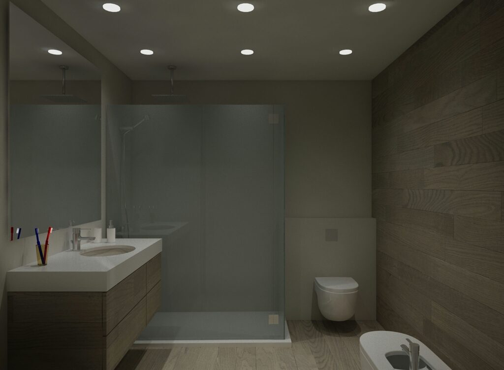 Baño moderno y elegante con diseño contemporáneo en Barcelona Interiores de baño modernos y elegantes que presentan materiales de alta calidad como madera y cristal. Incluye un mueble de lavabo elegante con un lavabo redondo y una ducha de vidrio espaciosa, todo con iluminación natural suave que realza los detalles arquitectónicos sofisticados.