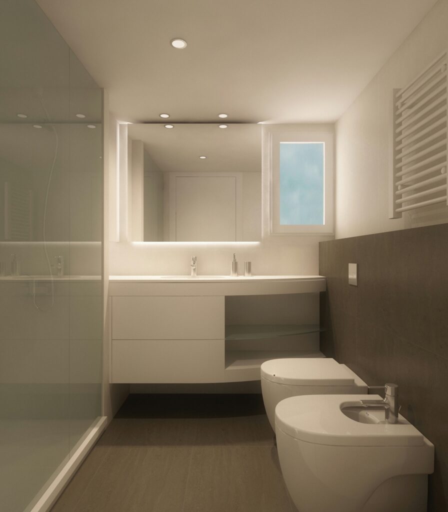 Diseño de baño moderno en Barcelona con arquitectura de alta gama Baño contemporáneo en Barcelona con acabado en blanco, encimera elegante y ducha de cristal sin marco