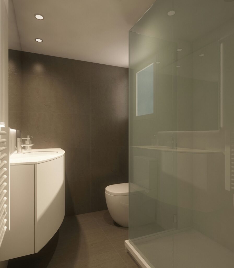 Baño Moderno de Alta Gama en Barcelona con Diseño Contemporáneo Baño contemporáneo de alta gama en Barcelona, mostrando un lavabo curvo y sanitarios elegantes en un espacio funcional con iluminación natural. Destacan las paredes de tonos oscuros y una ducha de vidrio minimalista con acabados en materiales de alta calidad.
