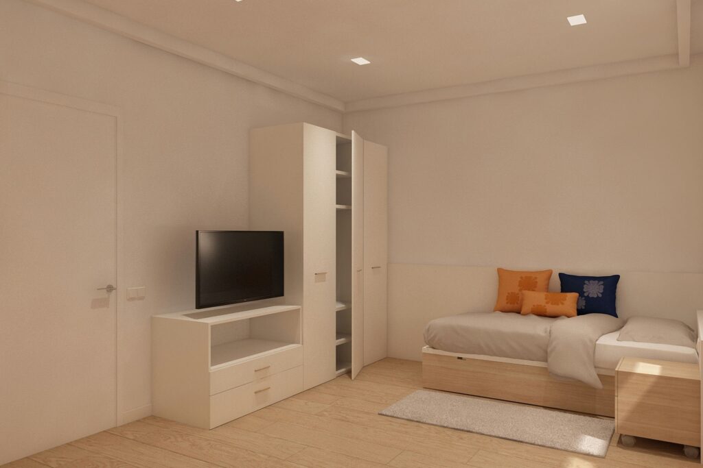 Diseño de interiores de dormitorio moderno en Barcelona Interior de dormitorio contemporáneo en Barcelona con suelos de madera clara, armario blanco elegante, y una cama con cojines decorativos en tonos naranja y azul, iluminado de forma natural.