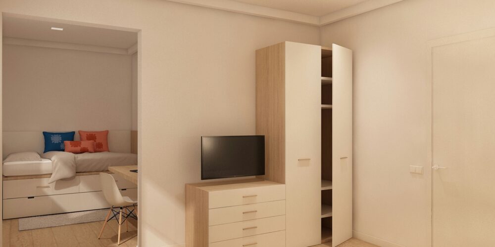 Interiores contemporáneos en Barcelona que muestran un espacio estilizado con muebles de madera clara y una paleta de colores neutra, resaltando funcionalidad y estética.