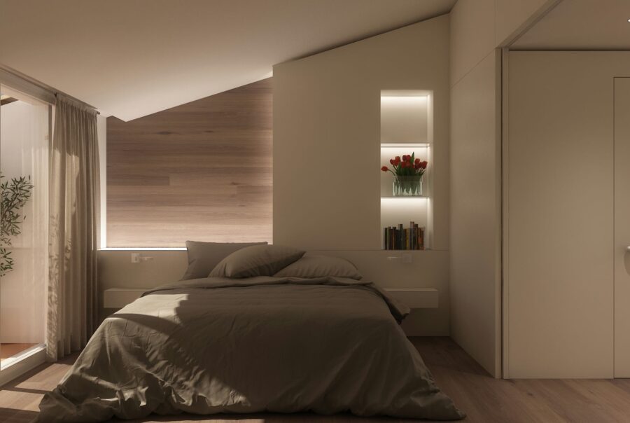 Elegante dormitorio con diseño contemporáneo en Barcelona, equipado con cama acogedora, iluminación natural, paredes de madera y acceso a un área exterior a través de puertas de cristal.