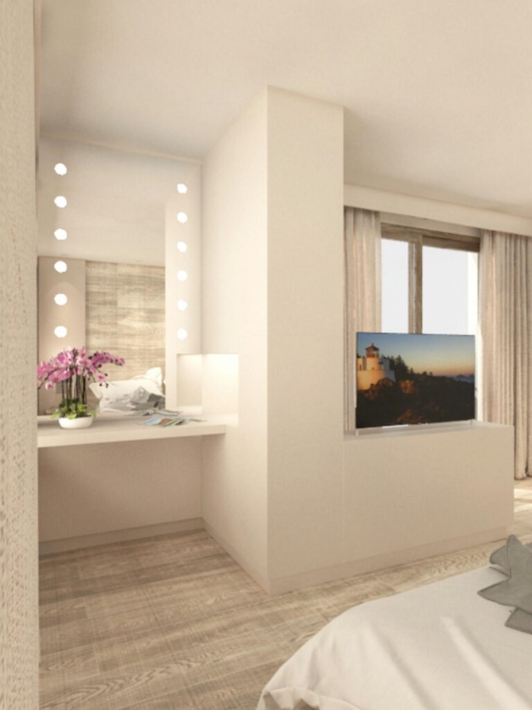 Diseño de interiores moderno en Barcelona: Habitación iluminada con elegancia Espacio moderno de diseño interior en Barcelona con una habitación bien iluminada, cama blanca y mesa de maquillaje. Detalles en madera de alta calidad, orquídeas decorativas y un televisor montado en la pared complementan la estética contemporánea.