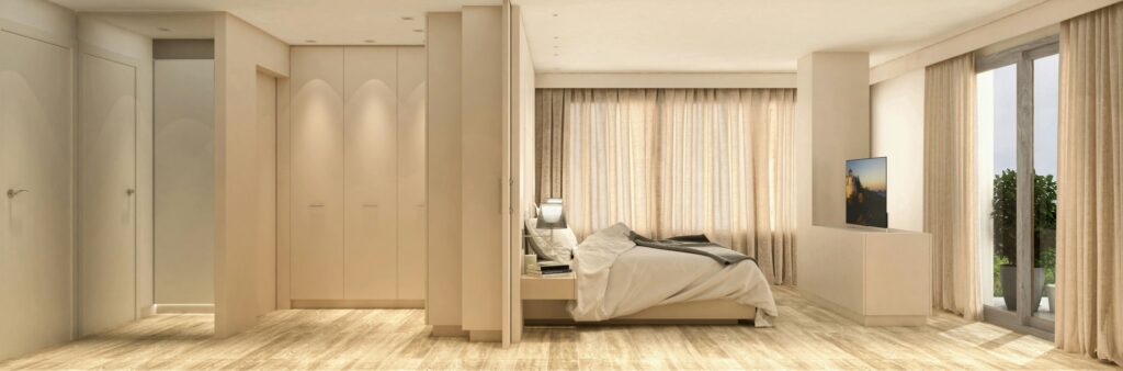 Diseño de interiores de lujo en Barcelona: habitación moderna y funcional Habitación moderna y lujosa en Barcelona con paredes beige, suelo de madera, grandes ventanas de suelo a techo y mobiliario contemporáneo