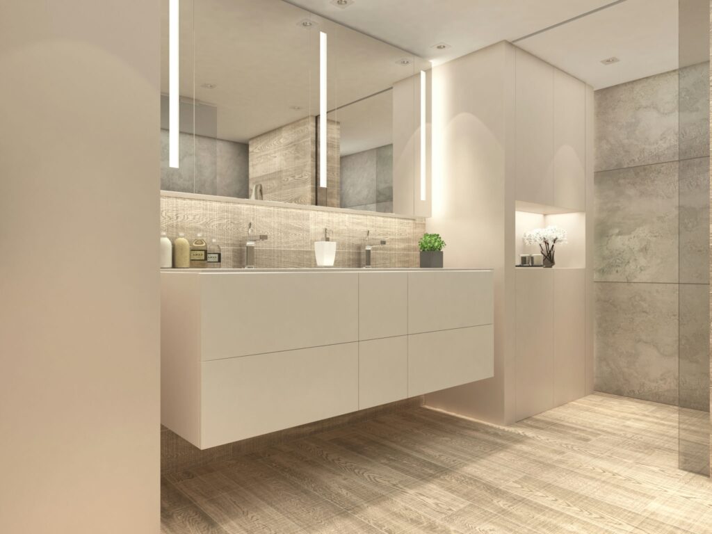Diseño de Baño Moderno de Alta Gama en Barcelona Baño contemporáneo en Barcelona con mobiliario de alta gama, incluyendo un doble lavabo blanco, suelos de madera natural y detalles en mármol y cristal.