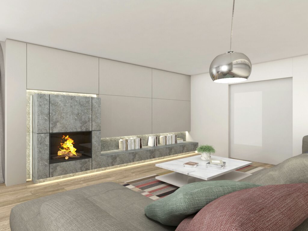 Proyecto de Diseño de Interiores Moderno en Barcelona con Estilo Contemporáneo Diseño de interiores moderno en Barcelona, que presenta una sala de estar contemporánea con un sofá gris elegante, cojines coloridos, una mesa de café blanca y una pared minimalista con una chimenea integrada de mármol de alta calidad.