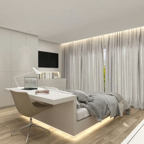 Interiores de un dormitorio contemporáneo en Barcelona con un diseño minimalista que destaca la funcionalidad y materiales de alta calidad. El espacio incluye un escritorio moderno, una cama elegante y grandes ventanas que permiten la entrada de luz natural.