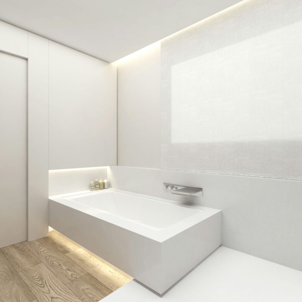 Diseño de interiores moderno en baño de alta gama en Barcelona Un baño moderno y elegante en Barcelona, destacando una bañera blanca, iluminación de pared sofisticada y suelo de madera, todos elementos de un diseño de interiores de alta gama.