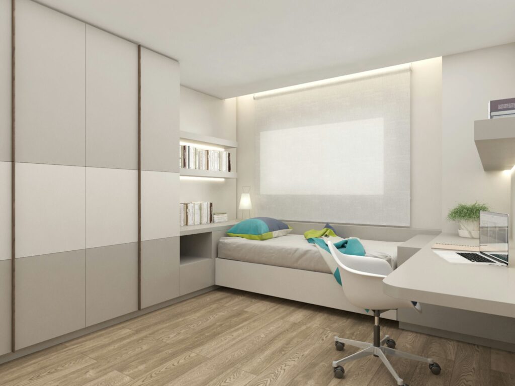 Diseño de interiores de alta gama en Barcelona: dormitorio moderno y contemporáneo Proyectos de diseño de interiores en Barcelona que muestran un dormitorio elegante con mobiliario personalizado en tonos neutros, armario empotrado de madera clara, cama con ropa de cama suave y escritorio minimalista, resaltando la estética funcional y la iluminación natural.