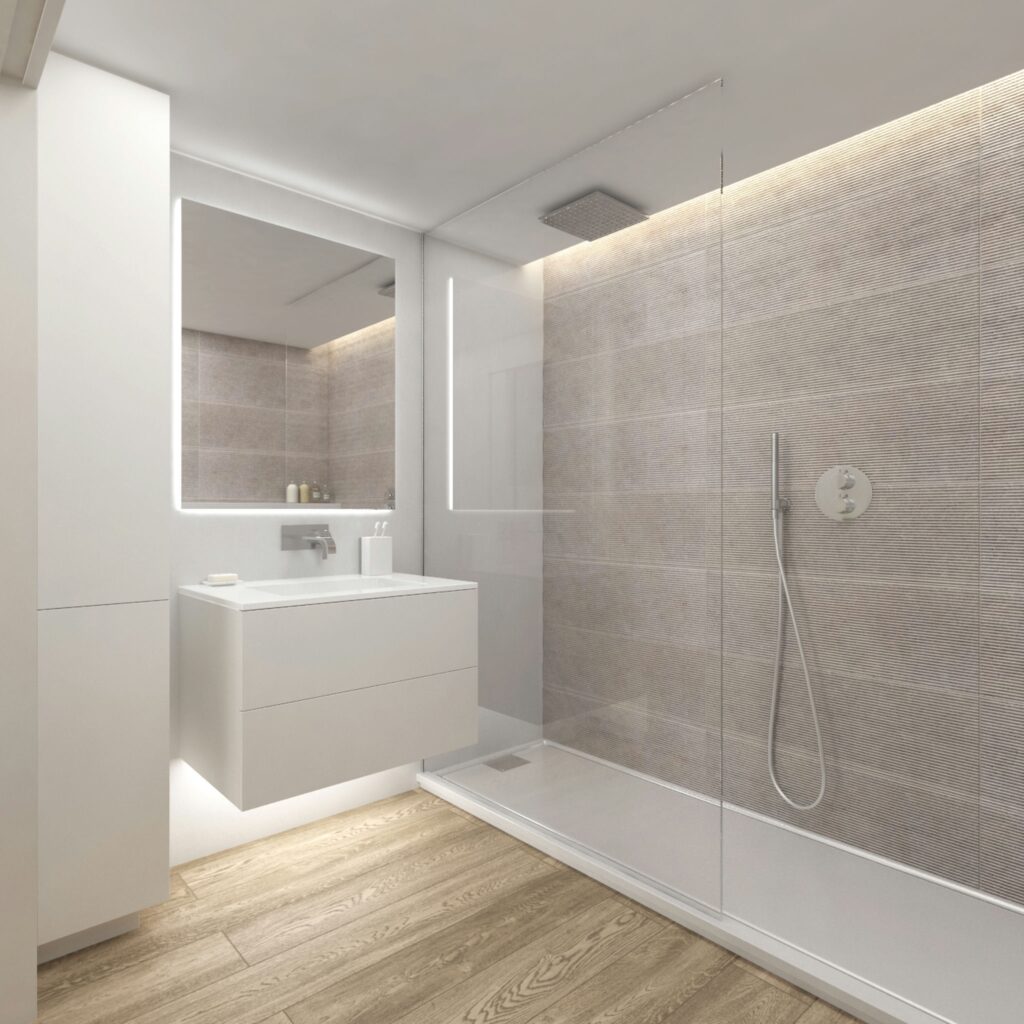 Baño moderno de diseño interior en Barcelona con arquitectura de alta gama Interior de un baño moderno en Barcelona, destacando arquitectura de alta gama, ducha amplia con puertas de cristal, paredes de azulejos grises, y un lavabo elegante con encimera blanca.