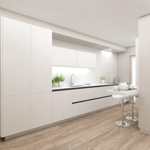 Cocina moderna con arquitectura de alta gama en Barcelona, caracterizada por mobiliario blanco, encimera minimalista, taburetes cromados y un ambiente iluminado por luz natural, combinando madera y detalles arquitectónicos sofisticados.