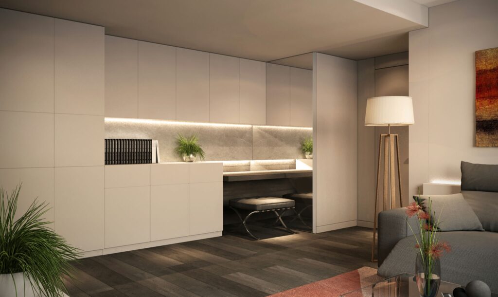 Diseño de interiores moderno y sofisticado en oficina de Barcelona Oficina moderna en Barcelona con mobiliario contemporáneo y acabados en mármol. Destacan la iluminación LED sutil, un escritorio elegante y un sofá gris, todo rodeado de vegetación que aporta calidez al espacio.